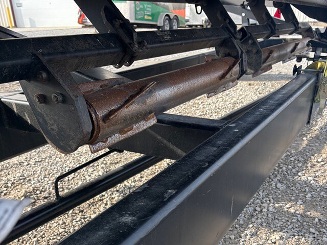 view of a stalk devastator underneath the 20 23 G T S X 10 8 row corn head