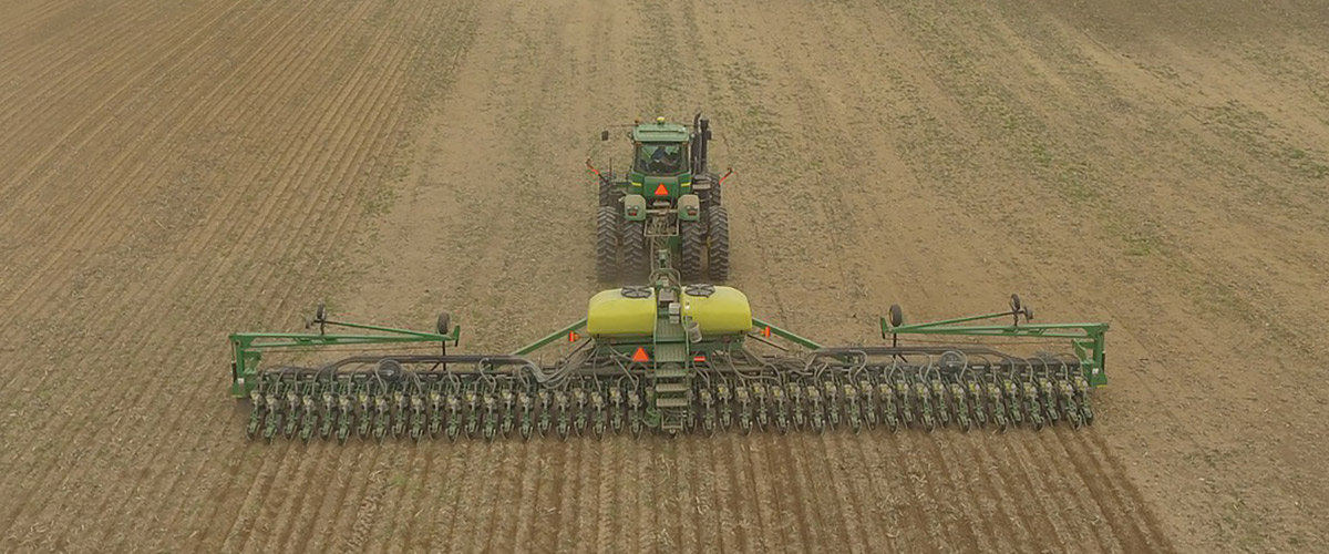 tractor and planter in field